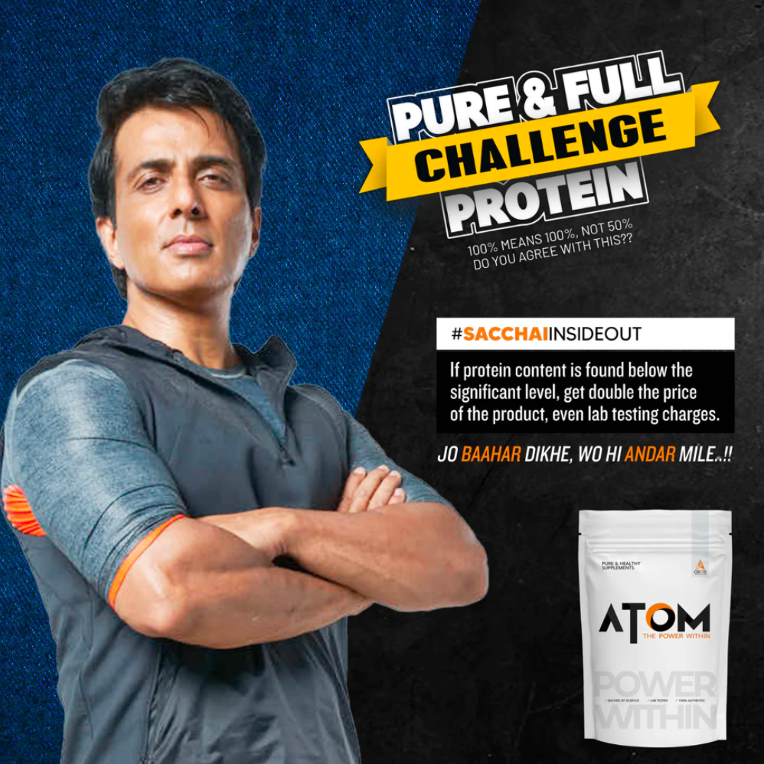 Man with crossed arms next to Atom Protein packaging on a blue and black background