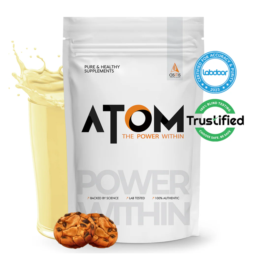 ATOM supplement package with cookies and a splash of milk on a white background