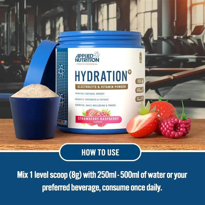 Applied Nutrition Hydration powder container with strawberries on a wooden surface, gym background.