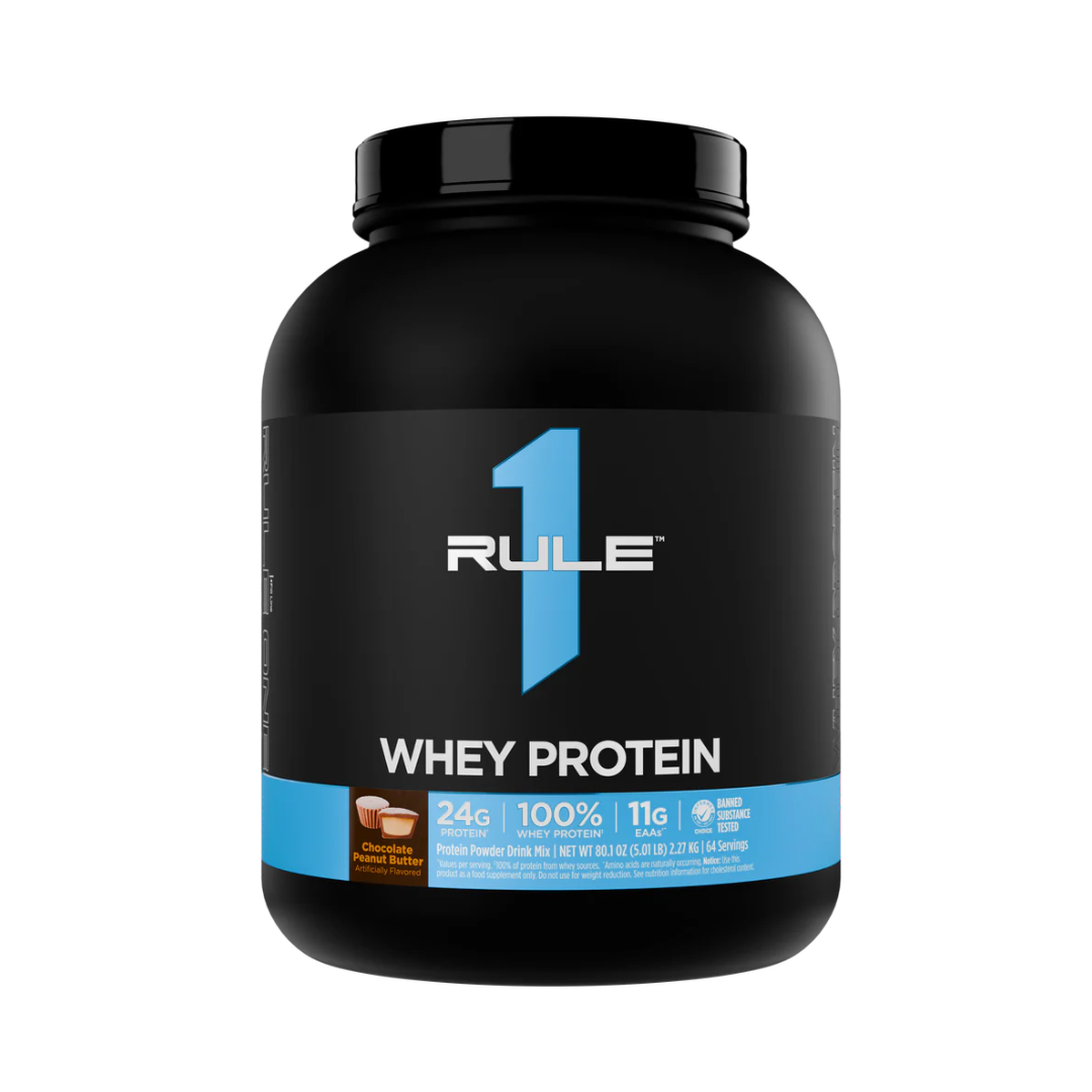 Black protein powder container with Rule 1 branding on a white background