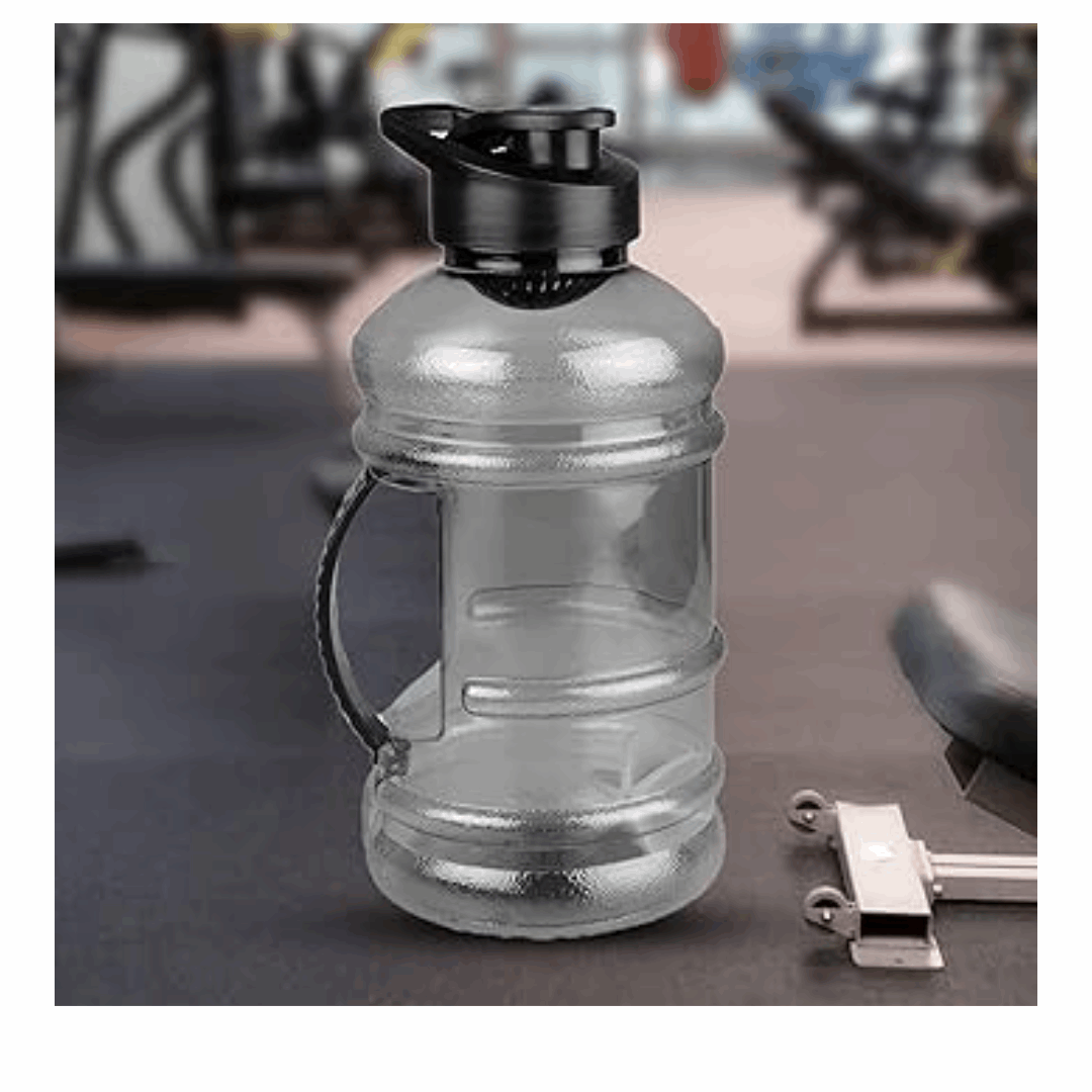 Large water bottle with black cap on a gym floor