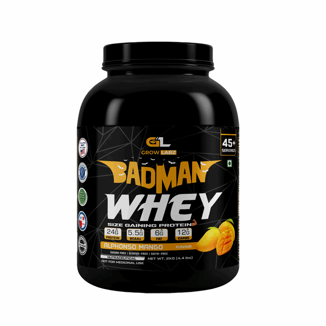 Black container of Badman Whey protein powder with a mango flavor on a white background