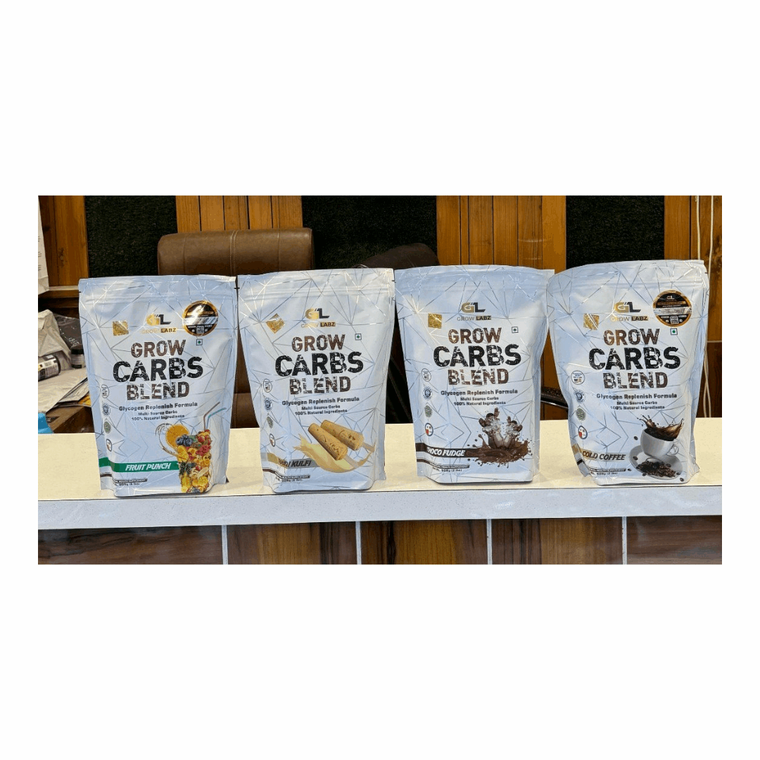 Four packages of 'Grow Carbs Blend' on a table with a blurred background
