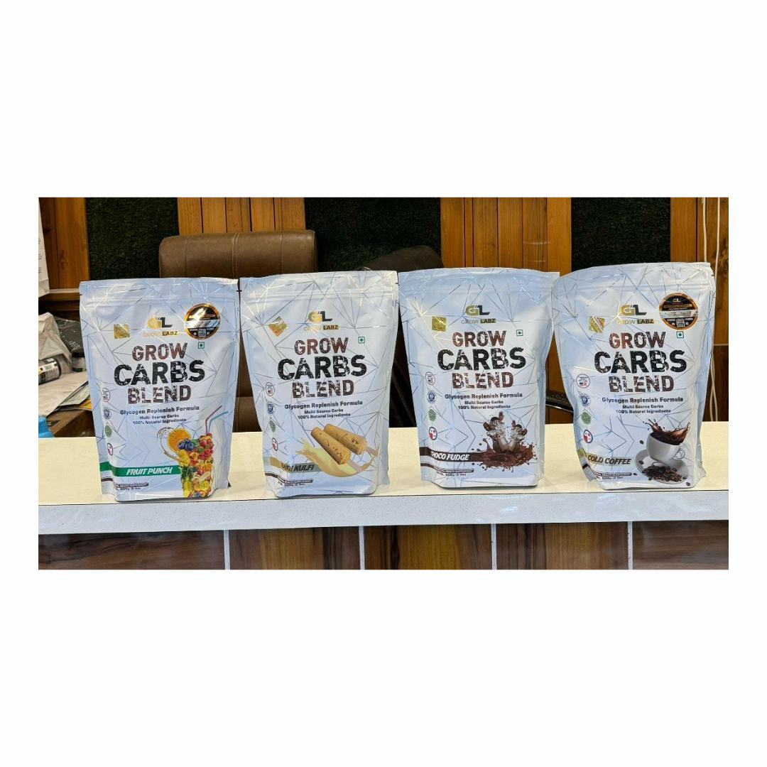 Four packages of 'Grow Carbs Blend' on a table with a blurred background