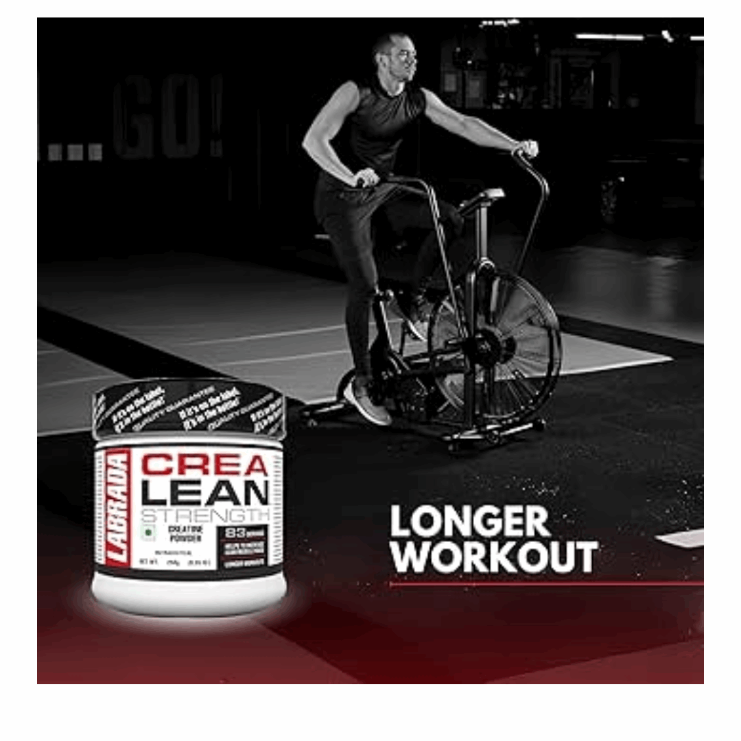 Person on a stationary bike with Labrada Crea Lean supplement in the foreground, gym setting.