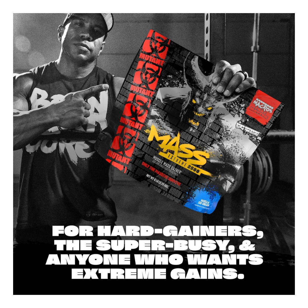 Person holding a supplement package with 'Mass' branding in a gym setting